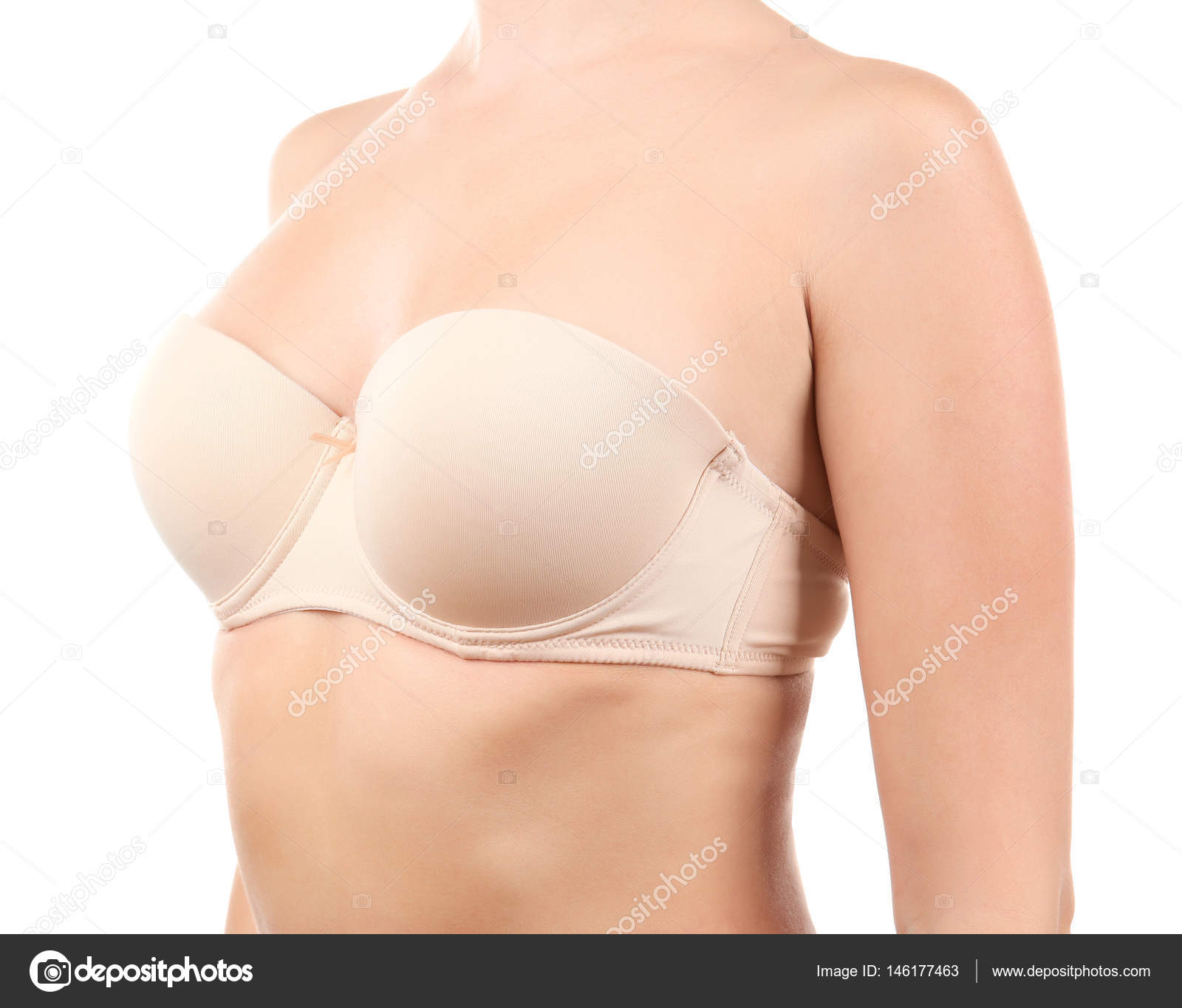 Female breast in a beige bra closeup. Isolate Stock Photo