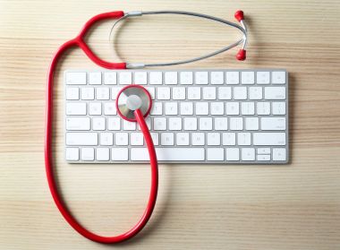 Stethoscope and modern computer keyboard  clipart