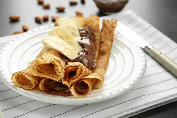 Delicious pancakes with chocolate and banana — Stock Photo, Image