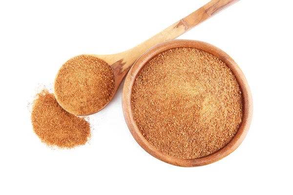 Bowl, wooden spoon and heap of coconut sugar — Stock Photo, Image