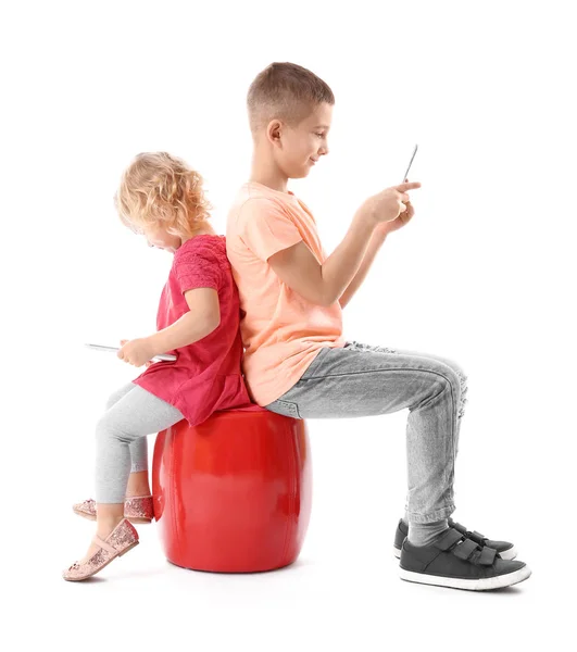 Little brother and sister with gadgets — Stock Photo, Image