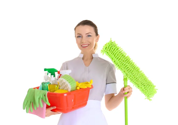 Beautiful chambermaid with cleaning equipment on white background — Stock Photo, Image