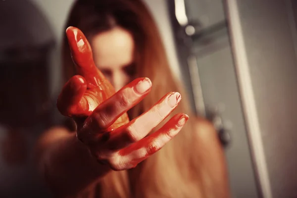 Woman with bloody hand — Stock Photo, Image