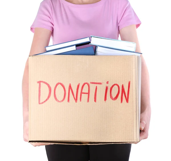 Woman holding donation box with books — Stock Photo, Image