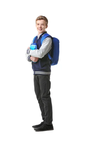 Мальчик-подросток с рюкзаком и книгами на белом фоне — стоковое фото