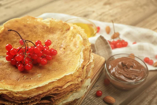 Pancakes decorated with viburnum — Stock Photo, Image