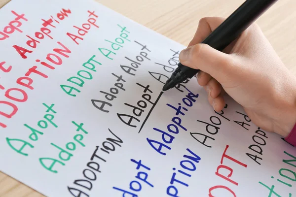 Hand writing word "Adoption" — Stock Photo, Image