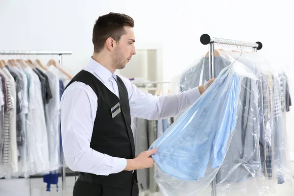 Man in dry-cleaning salon — Stock Photo, Image