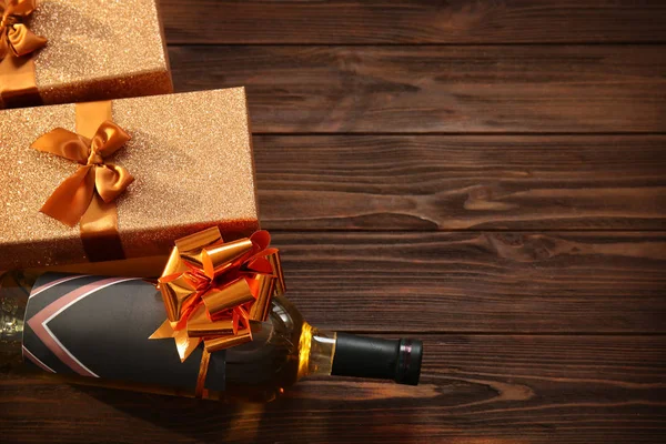 Decorated wine bottle and gift boxes — Stock Photo, Image