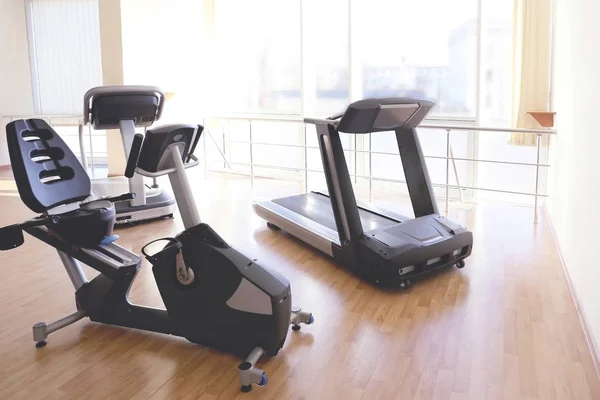 Exercise bike and treadmill in gym — Stock Photo, Image