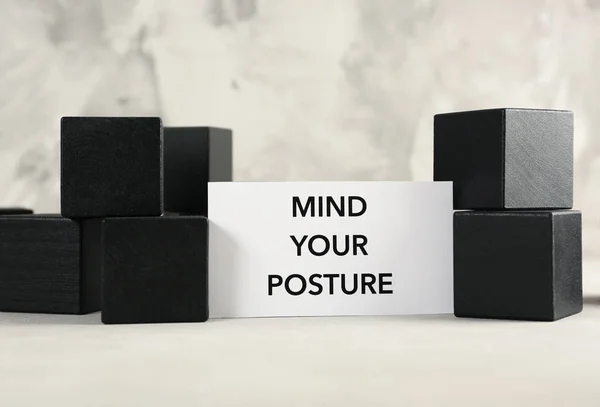 Paper with phrase Mind Your POSTURE — стоковое фото