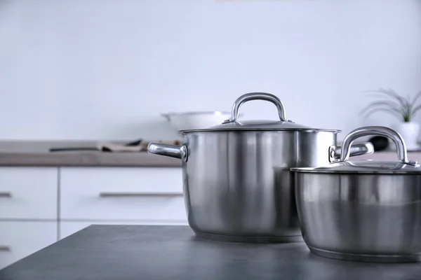Metal pans in kitchen — Stock Photo, Image