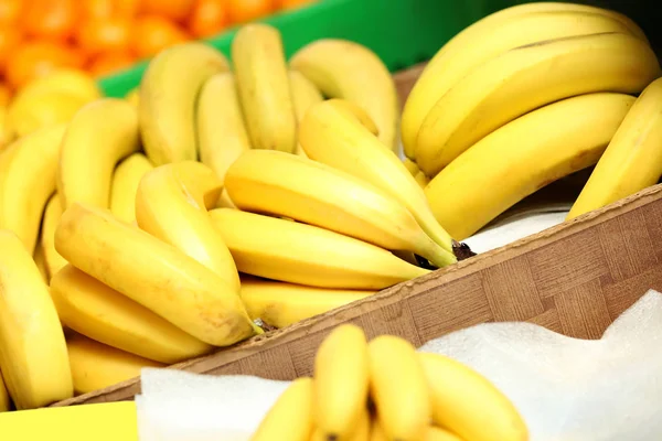 Baskets with bananas in market — Stock Photo, Image