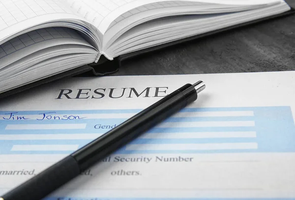 Resume with pen and notebook — Stock Photo, Image