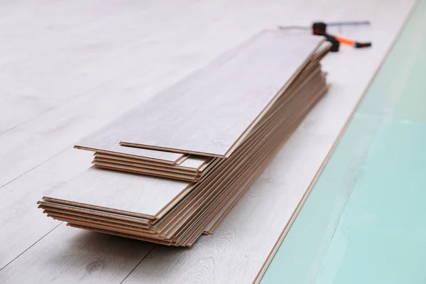 Wooden panels on new laminated flooring — Stock Image Wooden panels on new laminated flooring Stock Image