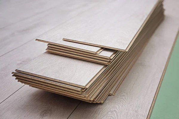 Wooden panels on new laminated flooring — Stock Image Wooden panels on new laminated flooring Royalty Free Stock Photos