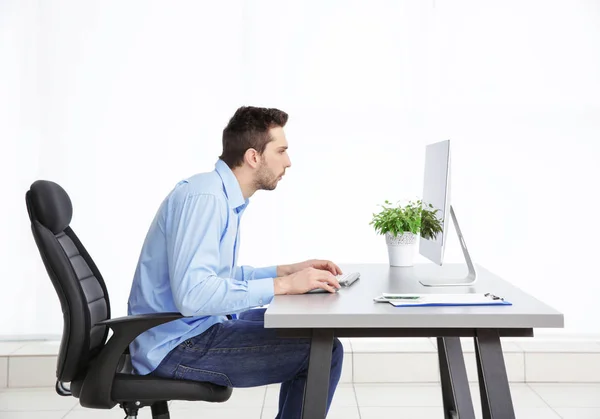 Incorrect posture concept. Man sitting at office table — Stock Image Incorrect posture concept. Man sitting at office table Royalty Free Stock Images