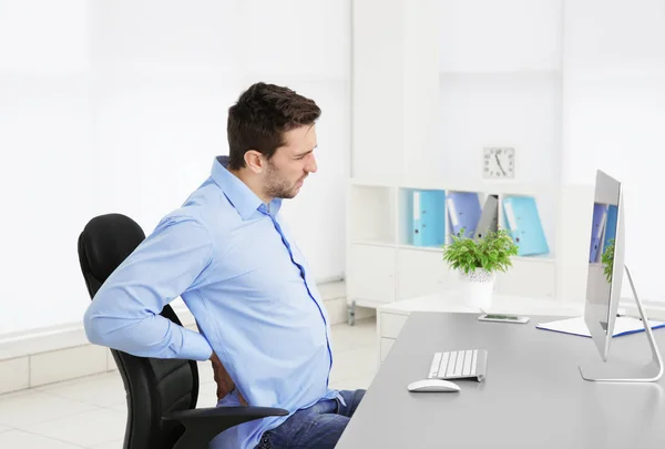Incorrect posture concept. Man sitting at office table — Stock Image Incorrect posture concept. Man sitting at office table Stock Photo