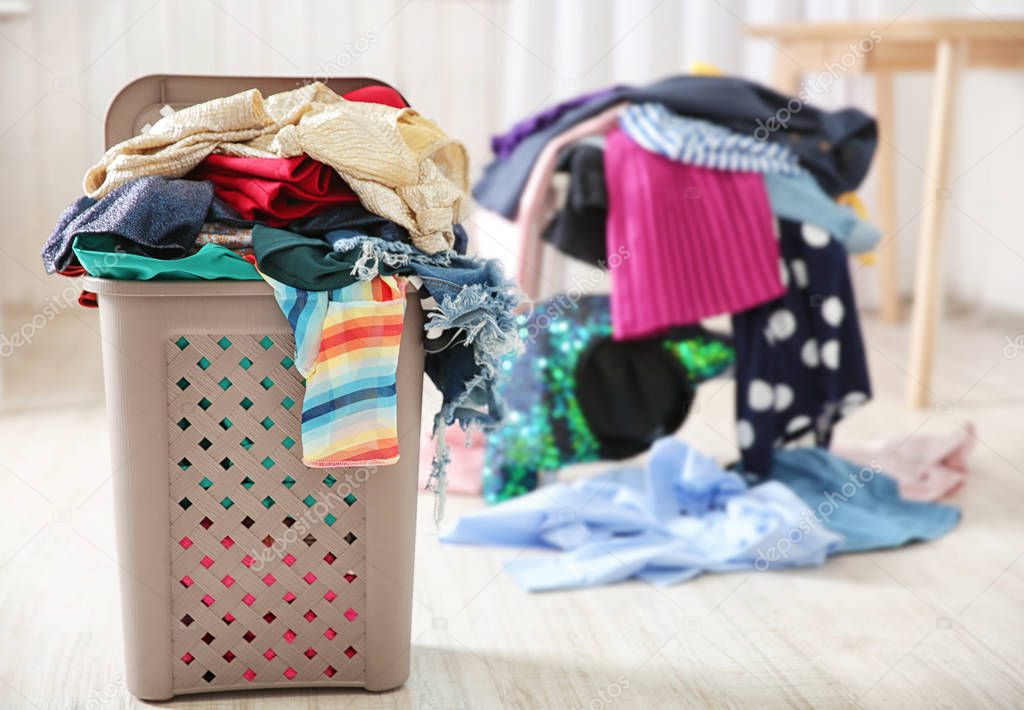 lothes in plastic laundry basket  