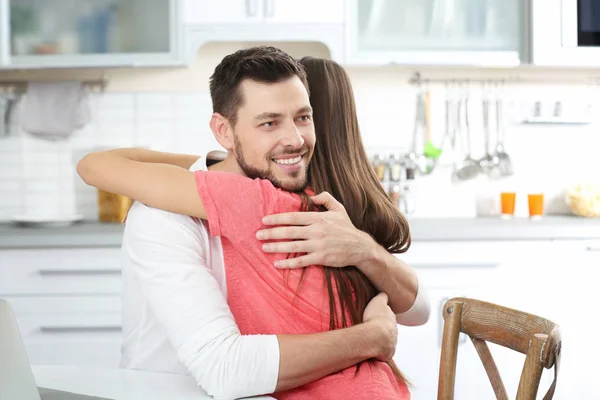 Young Couple Embracing Kitchen — Stock Photo, Image