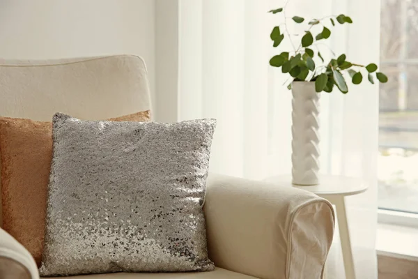 Two shiny decorative pillows on armchair — Stock Photo, Image