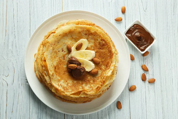 Delicious pancakes with banana and chocolate — Stock Photo, Image