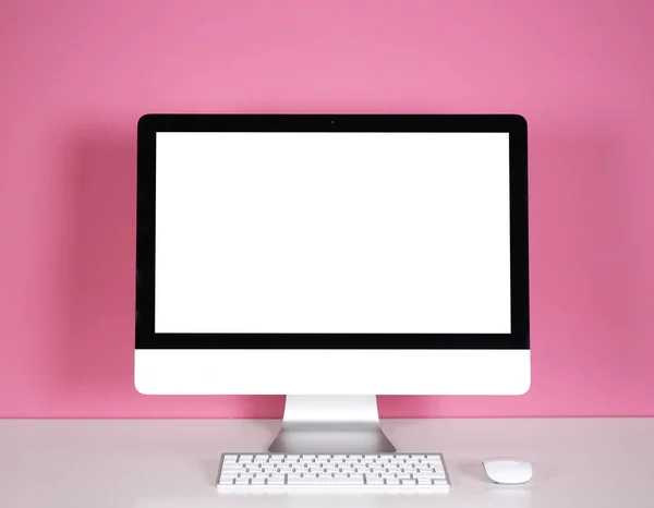 Computer display on white table