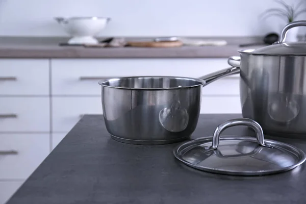 Metal pans in kitchen — Stock Photo, Image