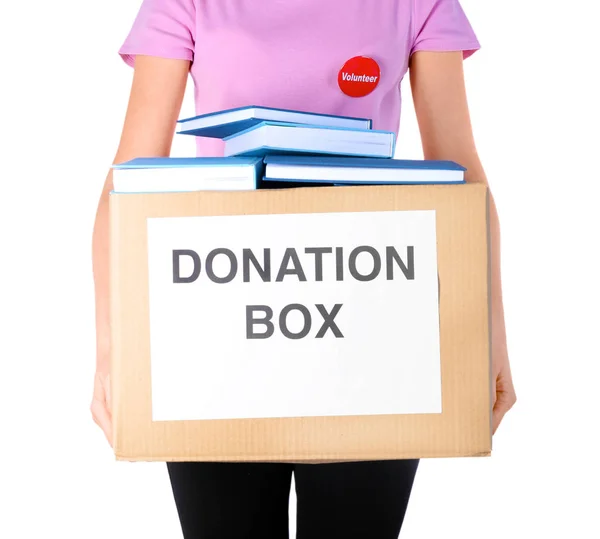Женщина с коробкой для пожертвований и книгами — стоковое фото