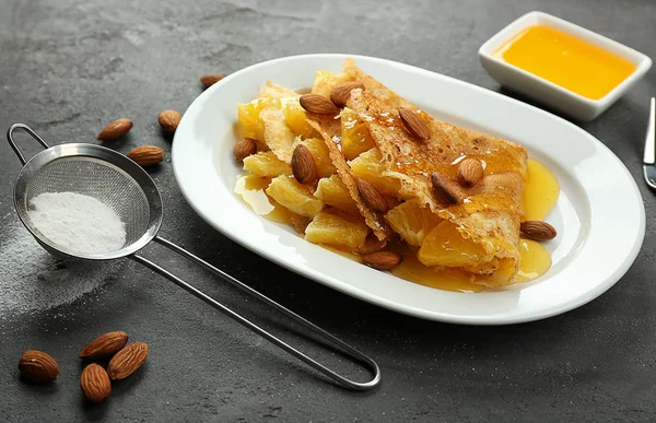 Pancakes with pineapple and almonds — Stock Photo, Image