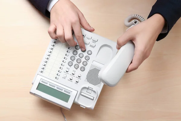 Man dialing telephone number — Stock Photo, Image