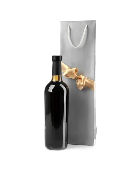 Wine bottle and gift bag on white background — Stock Photo, Image