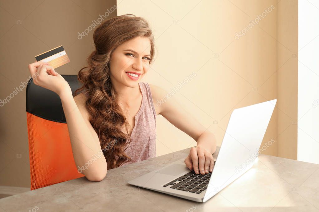 Young woman shopping online  