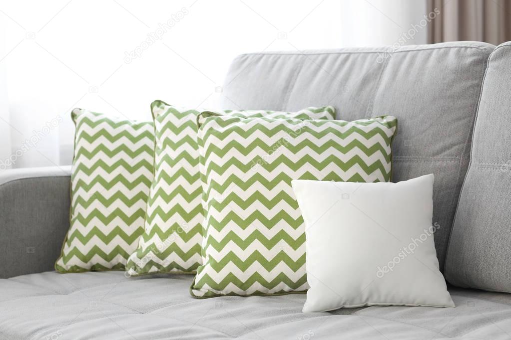 Blank soft pillow on sofa