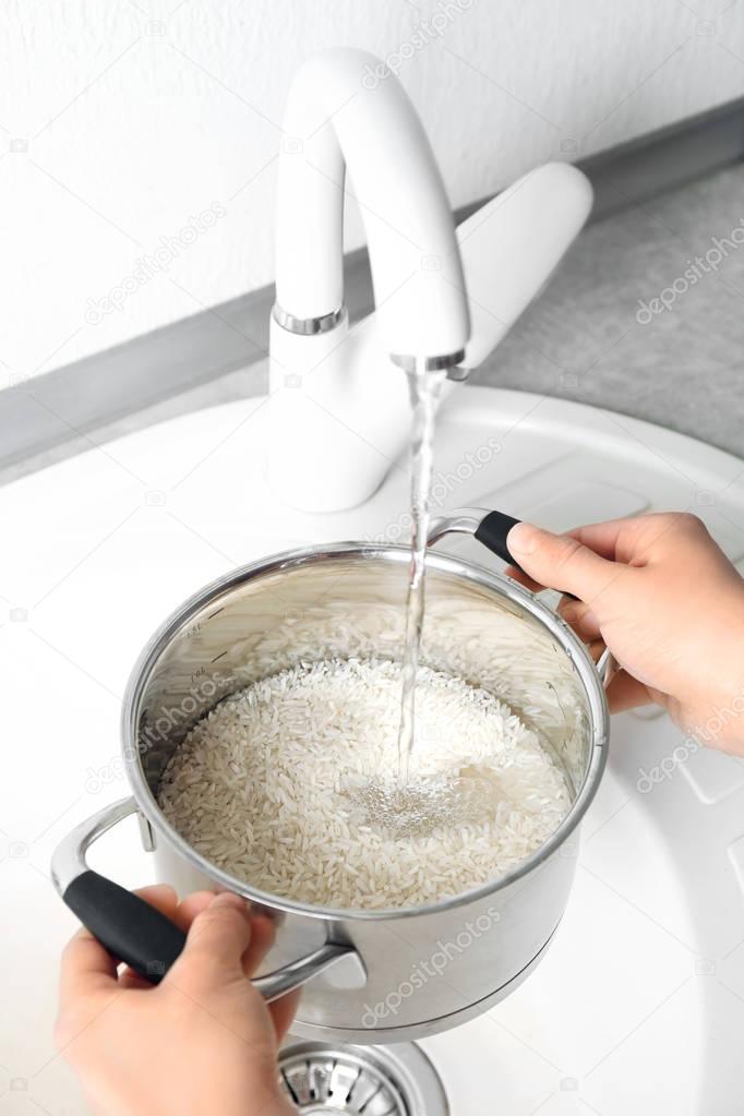 Woman rinsing rice 
