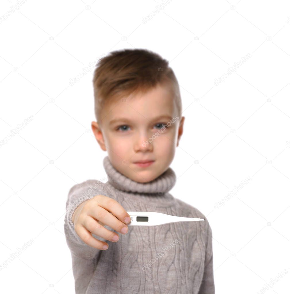 little boy showing thermometer 
