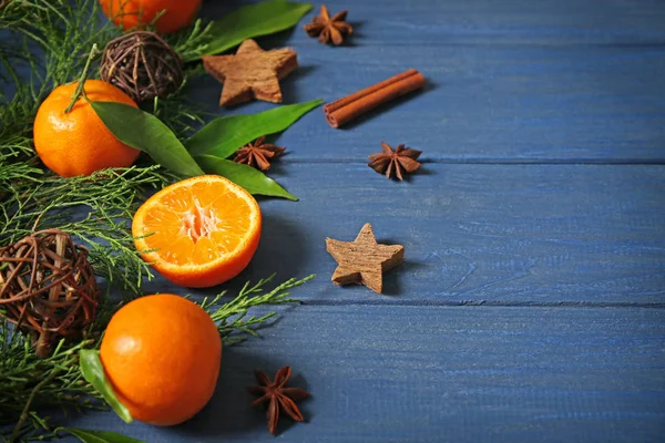 Composition of tangerines, spices and coniferous branches — Stock Photo, Image