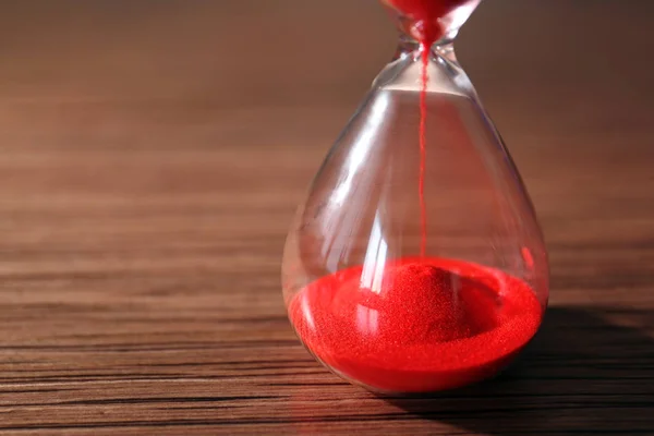 Crystal hourglass with red sand — Stock Photo, Image