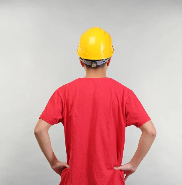 Confident warehouse worker on light background — Stock Photo, Image