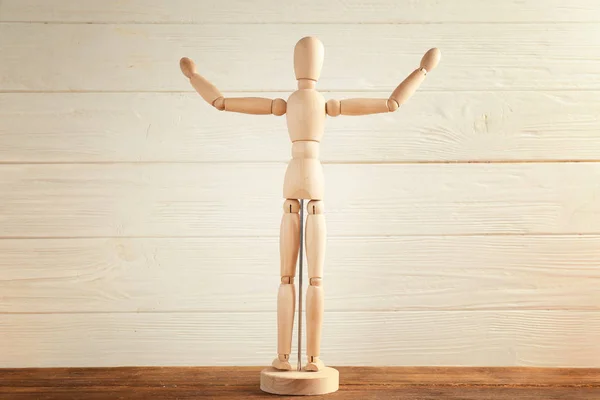 Wooden Mannequin Raised Hands Table Light Background — Stock Photo, Image