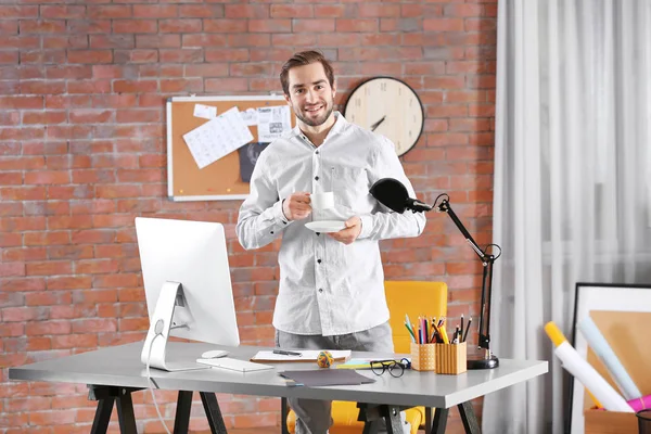 Designer drinking coffee — Stock Photo, Image