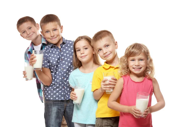 Children with glasses of milk on white background — Stock Photo, Image