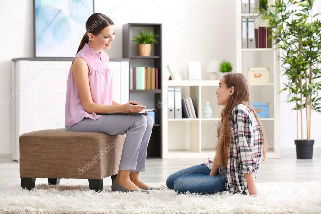 psychologist working with teenager girl