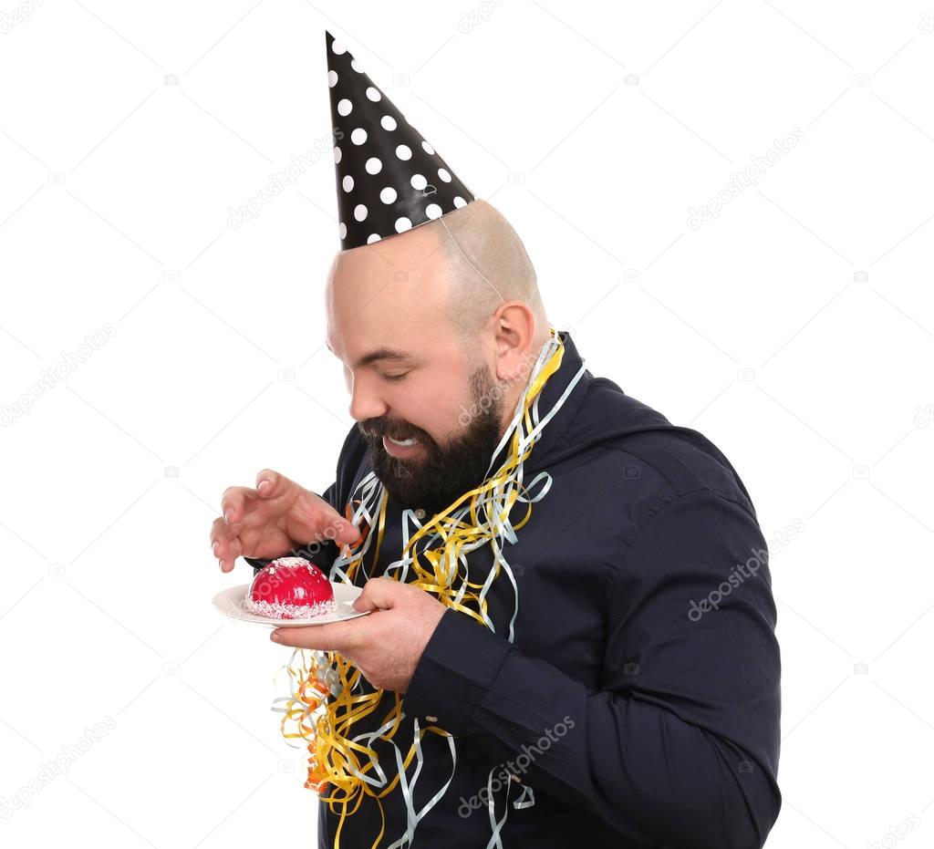 man with cake and party hat 
