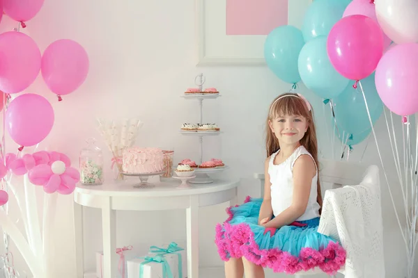 Girl in room decorated for birthday party — Stock Photo, Image