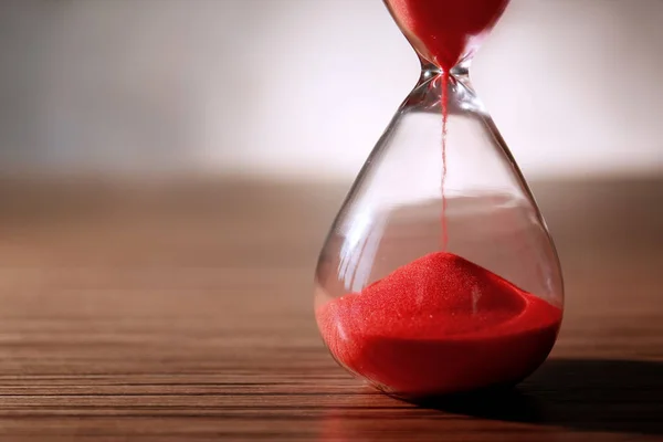 Crystal hourglass with red sand — Stock Photo, Image