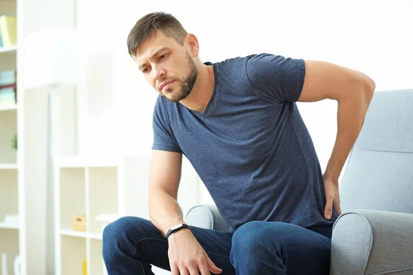 Young man suffering from backache — Stock Photo, Image