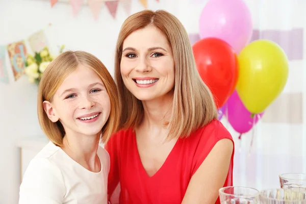 Mother with her child at  birthday party — Stock Photo, Image