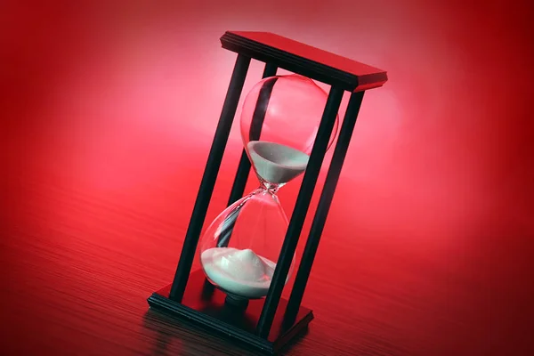 Hourglass with white sand — Stock Photo, Image