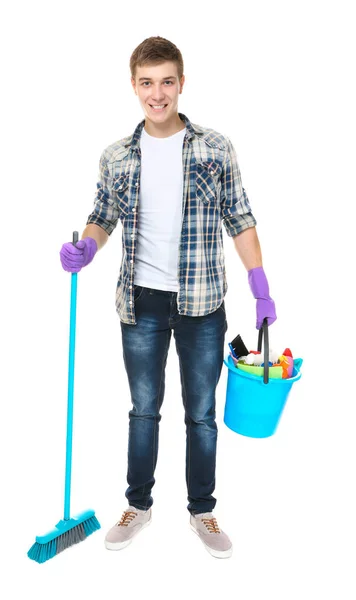 Junger Mann mit Reinigungsgeräten und Zubehör auf weißem Hintergrund — Stockfoto